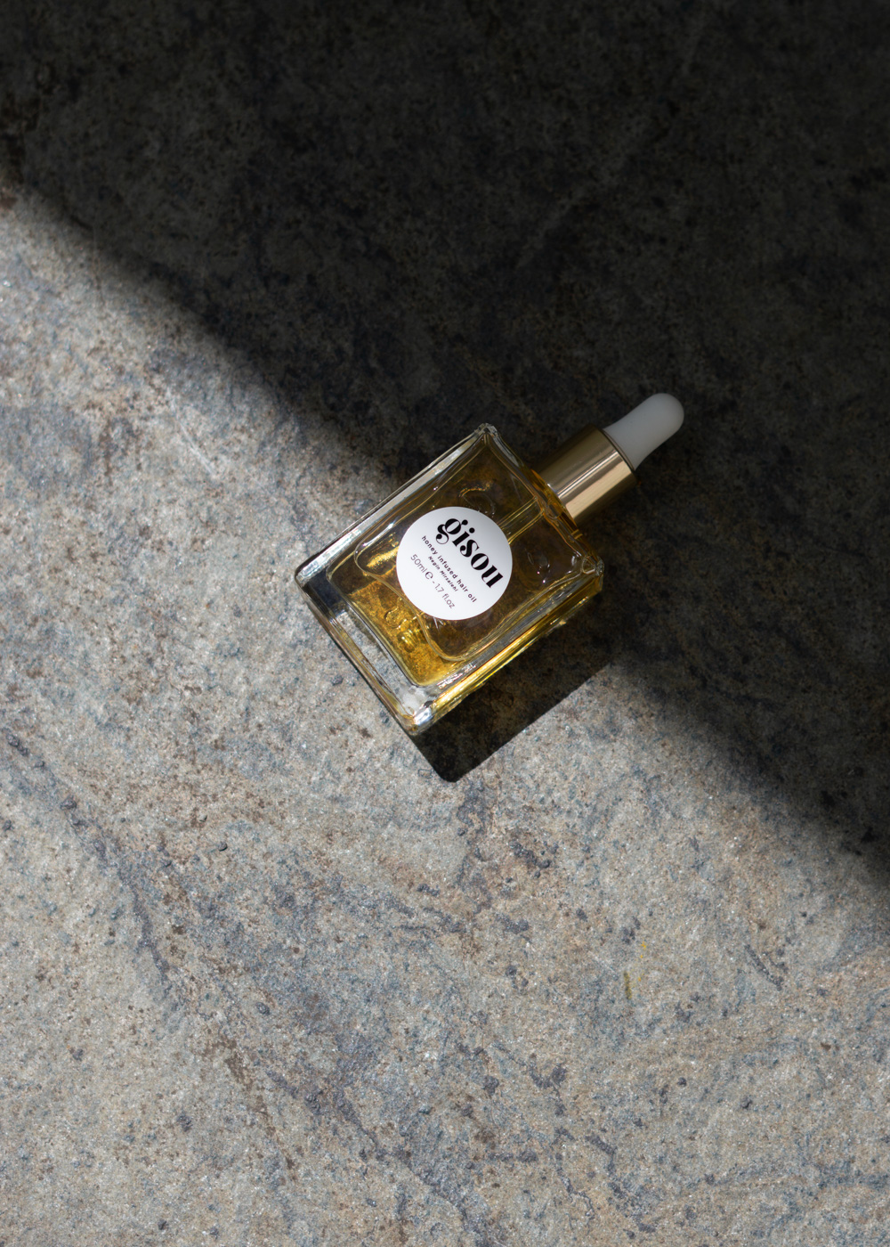 Gisou Honey Hair Oil - summer beauty editorial product photography light shadow play neutral style beige aesthetic wellness rebecca goddard rg daily (7)